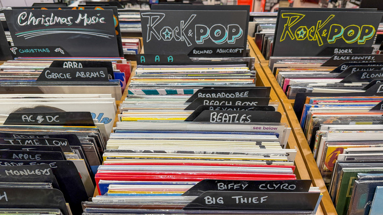 Vinyl records in a record store separated by genre.