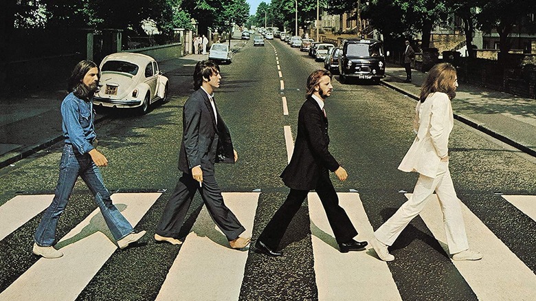 The Beatles walking across Abbey Road