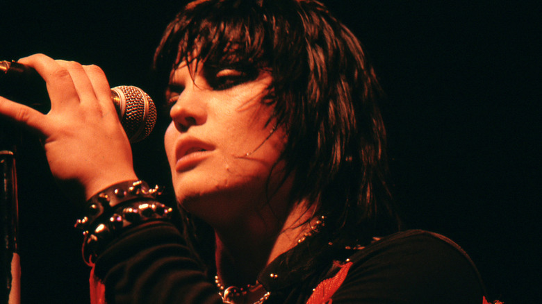 Joan Jett holding a microphone