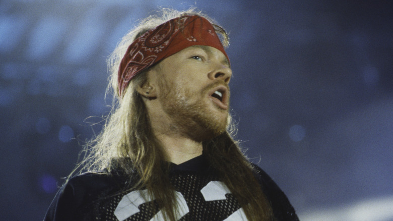 Axl Rose onstage in bandana