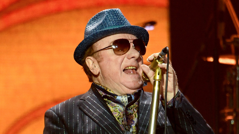 Van Morrison performing in pin stripe suit, hat, and sunglasses