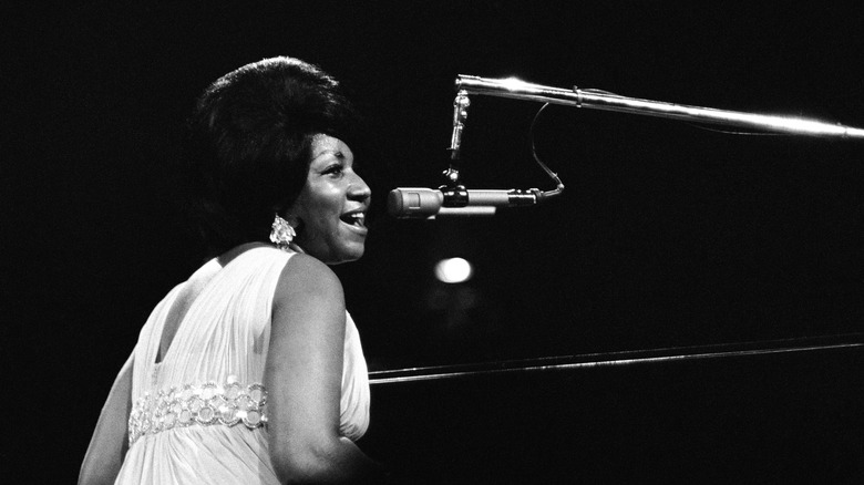 soul music icon Aretha Franklin performing at piano