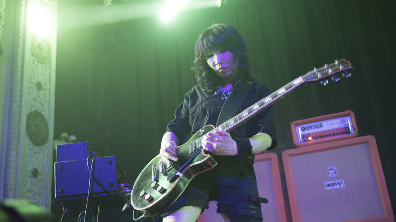 Wata from Boris on stage with guitar
