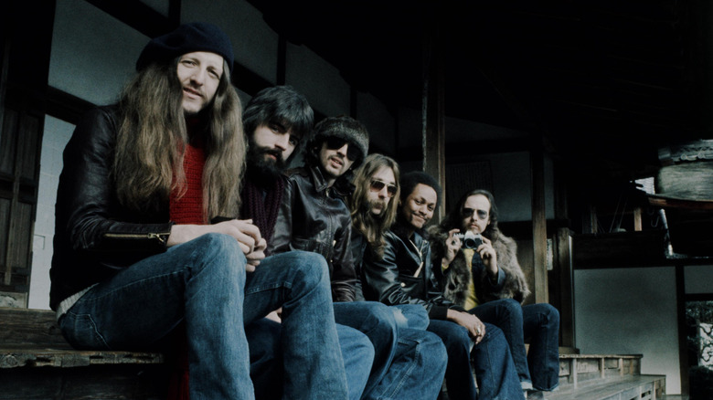 The members of the Doobie Brothers posing in a courtyard in Japan in 1976.