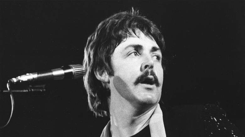 Paul McCartney onstage with mustache