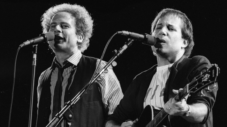 Simon & Garfunkel performing on stage.