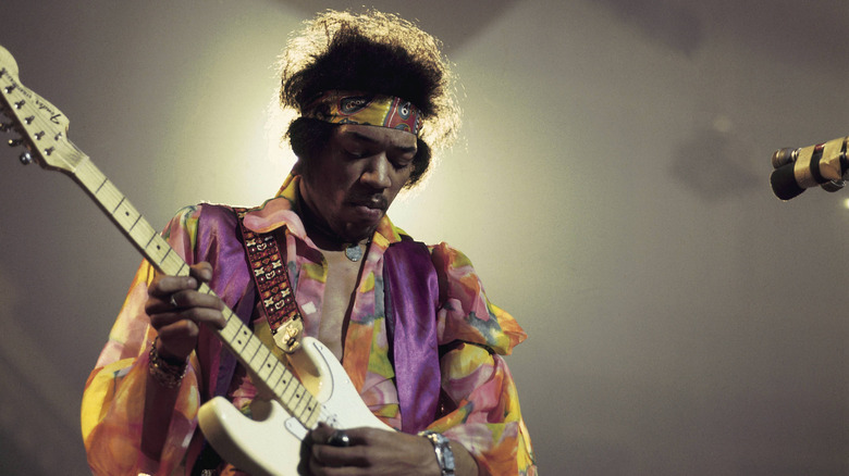 Jimi Hendrix playing a white Fender Stratocaster guitar, 1979