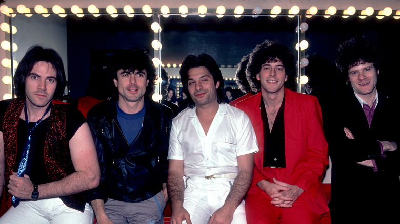 Prism band members in dressing room smiling