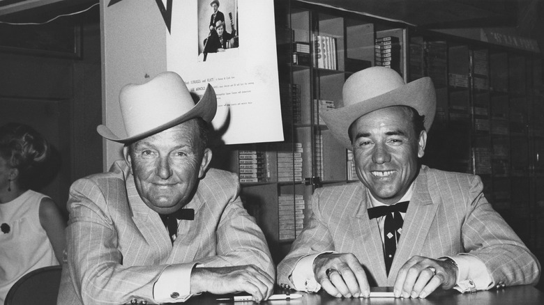 Bluegrass legends Lester Flatt and Earl Scruggs sit with smiles on their faces