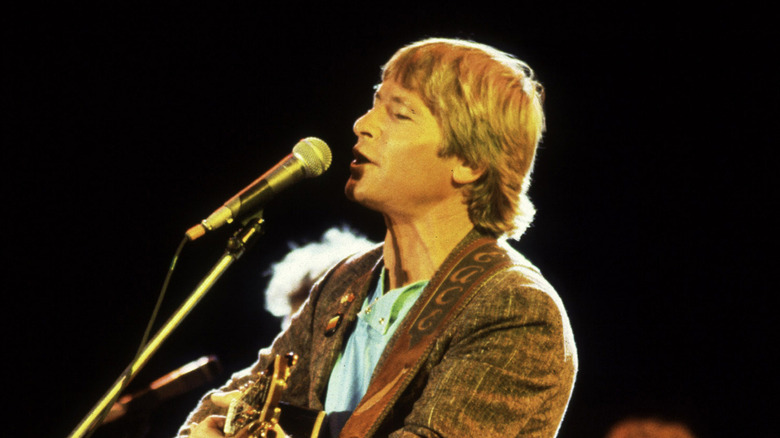 John Denver singing onstage