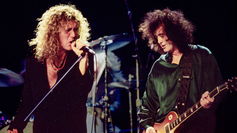 Robert Plant and Jimmy Page perform live on stage