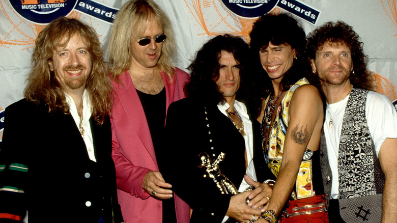 Aerosmith posing at MTV VMAs in 1990