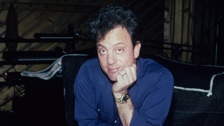 Billy Joel head on hand in studio