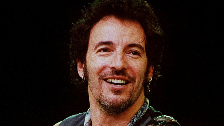 Bruce Springsteen smiling on stage