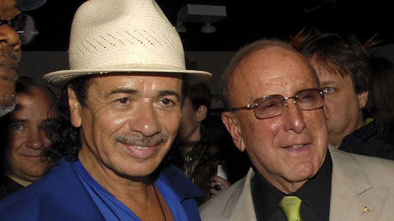 Carlos Santana smiling with Clive Davis