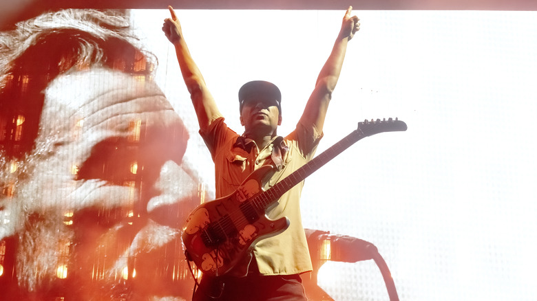 Tom Morello performing on stage