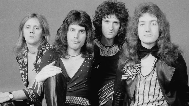 Queen sitting for band photo