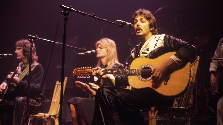 Paul McCartney performing with Wings on stage