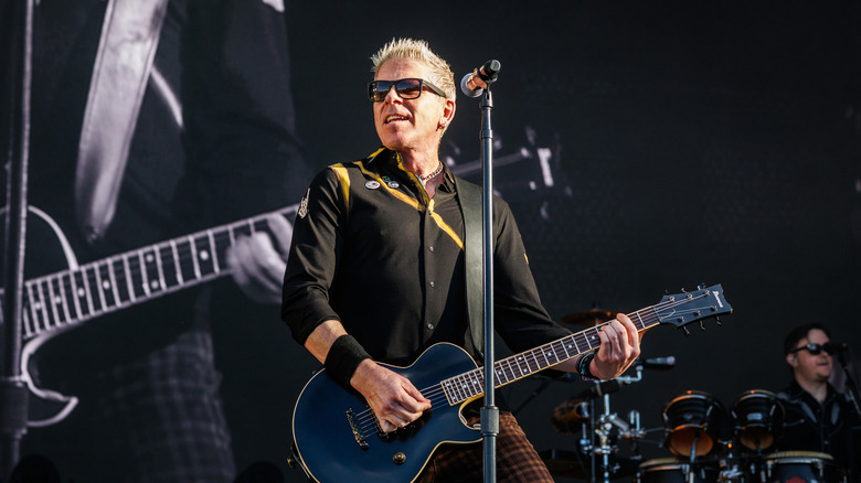 Dexter Holland onstage with guitar