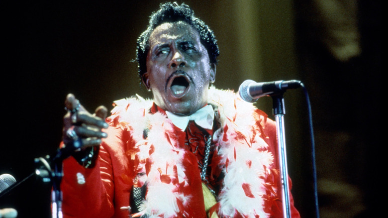 Screamin Jay Hawkins performing in red jacket