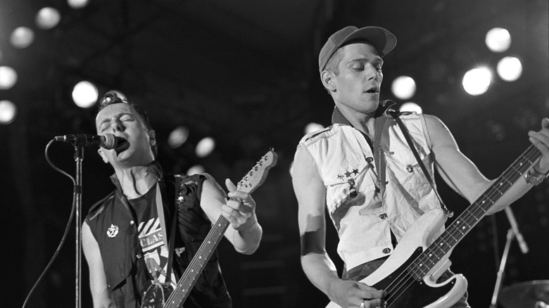 The Clash playing guitars and singing