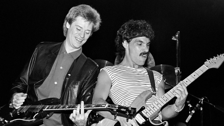 Daryl Hall and John Oates performing on stage