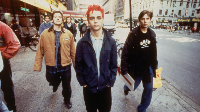 A young Green Day walking down the street in 1994