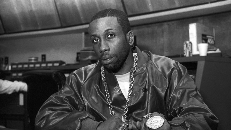 Rob Base wearing a satin jacket with lots of bling