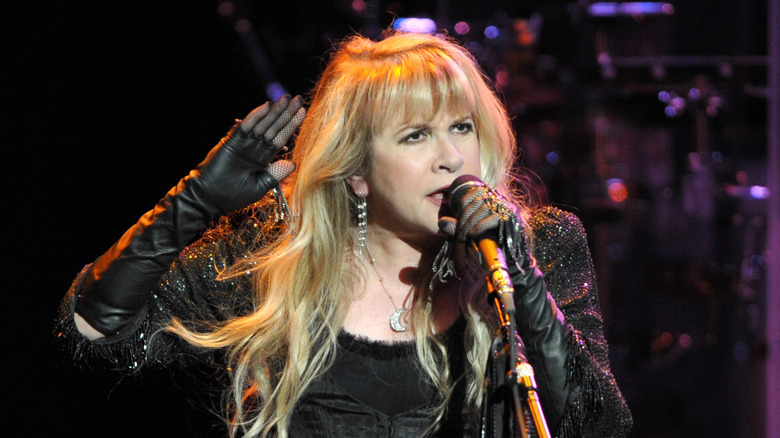Stevie Nicks singing in front of microphone, 2011