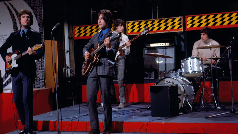 The Kinks performing live on stage.