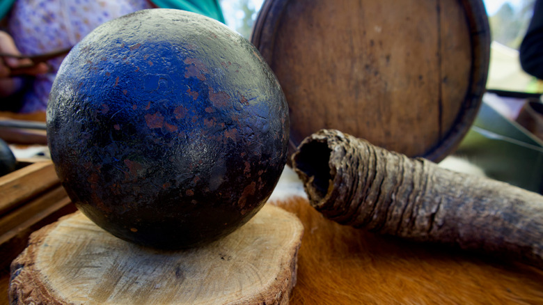 Antique cannonball on table