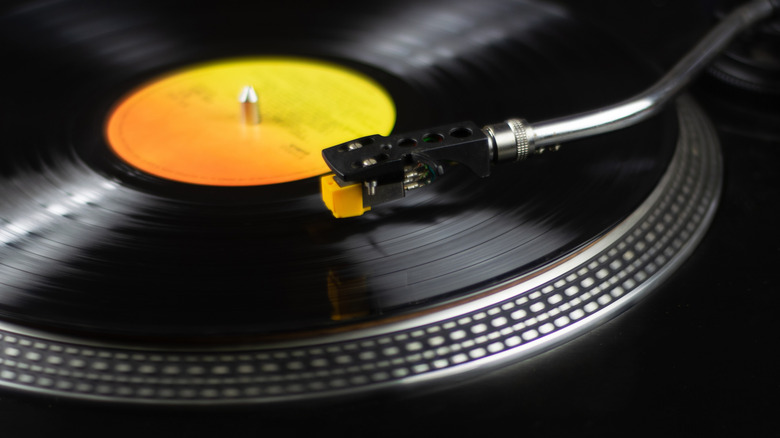 Close-up of a vintage turntable with a spinning vinyl record
