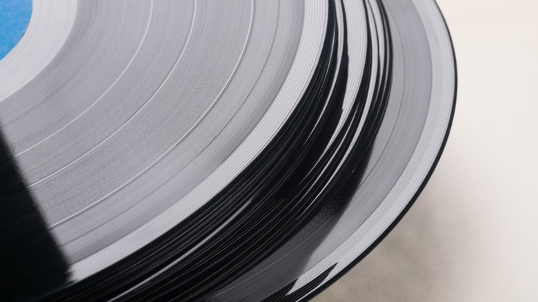 A stack of black vinyl records
