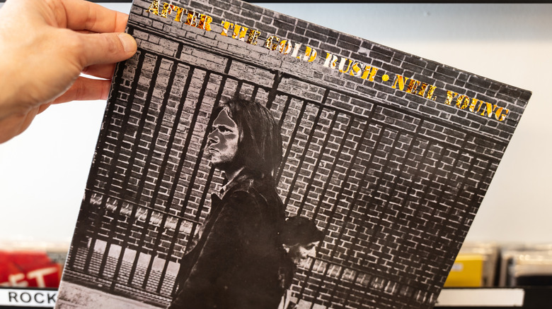 Hand holding Neil Young's "After the Gold Rush" LP