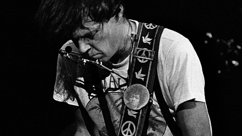 Neil Young shredding on electric guitar