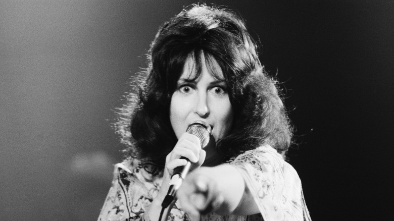 A black-and-white photo of Grace Slick performing