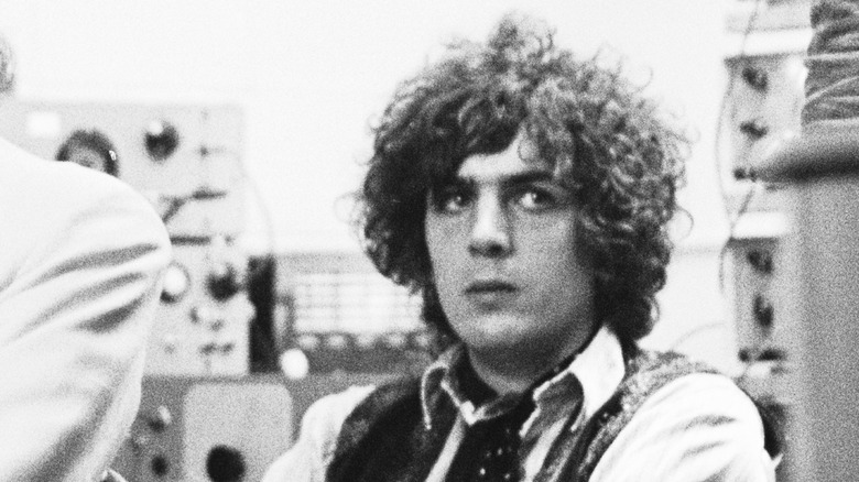 A black-and-white photo of Syd Barrett sitting at a 1967 BBC radio taping