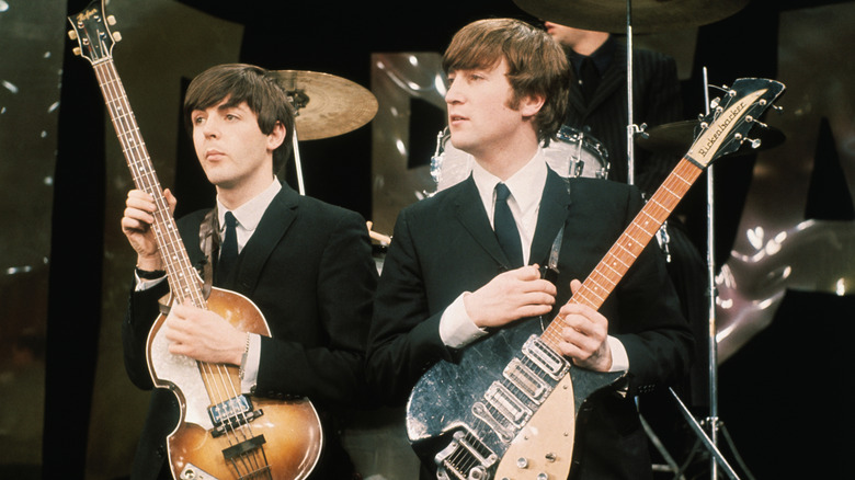The Beatles' Paul McCartney and John Lennon perform on The Ed Sullivan Show