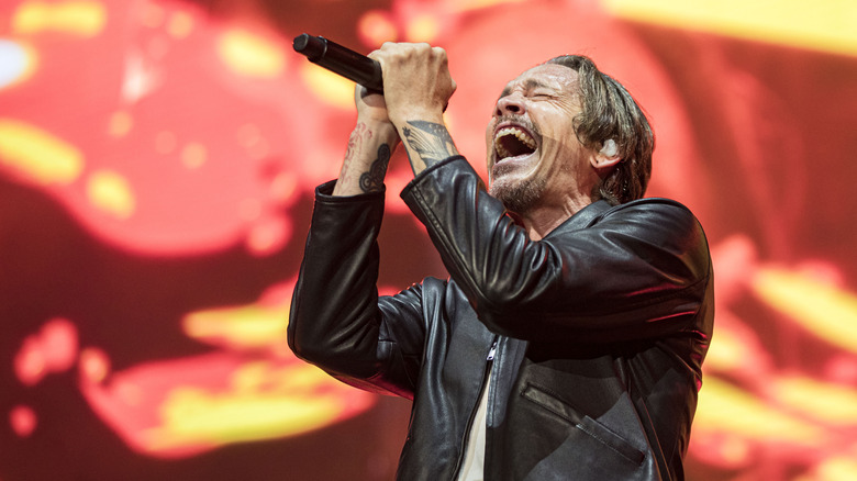 Brandon Boyd of Incubus singing into mic
