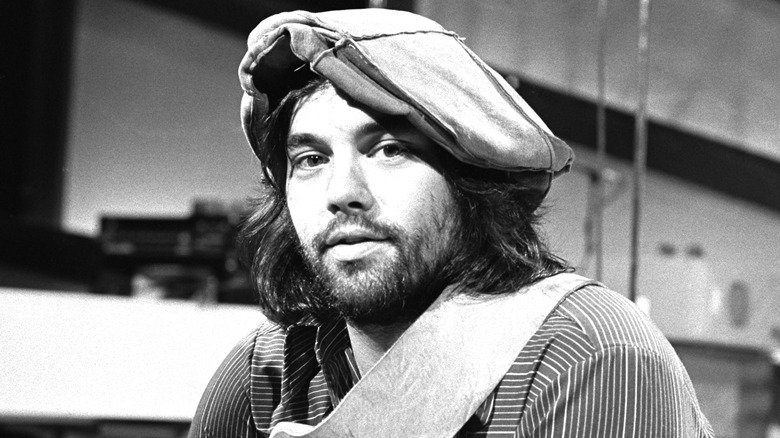 Lowell George sitting for photo in studio