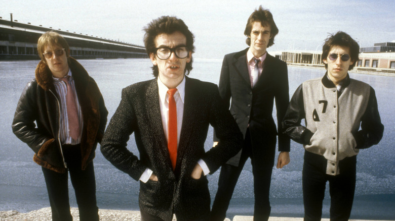 Elvis Costello and the Attractions on a beach in the '70s