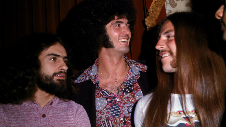 Grand Funk Railroad smiling and looking around