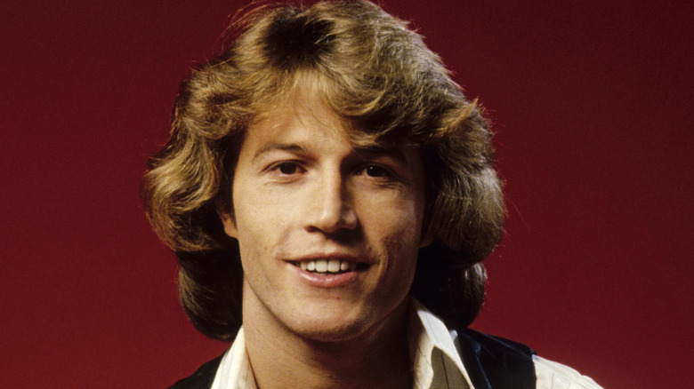Andy Gibb smiling at camera