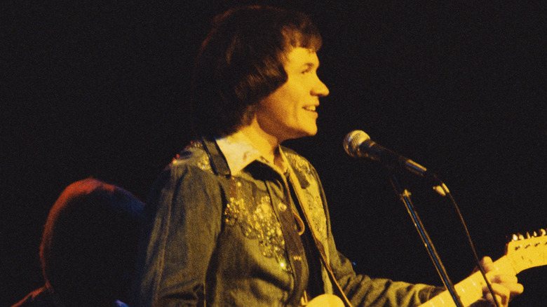 David Gates playing onstage with guitar