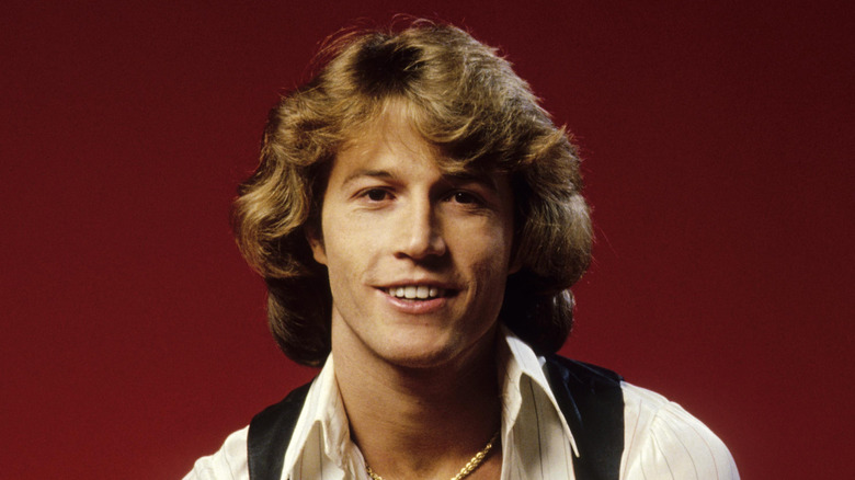 Andy Gibb smiling at camera
