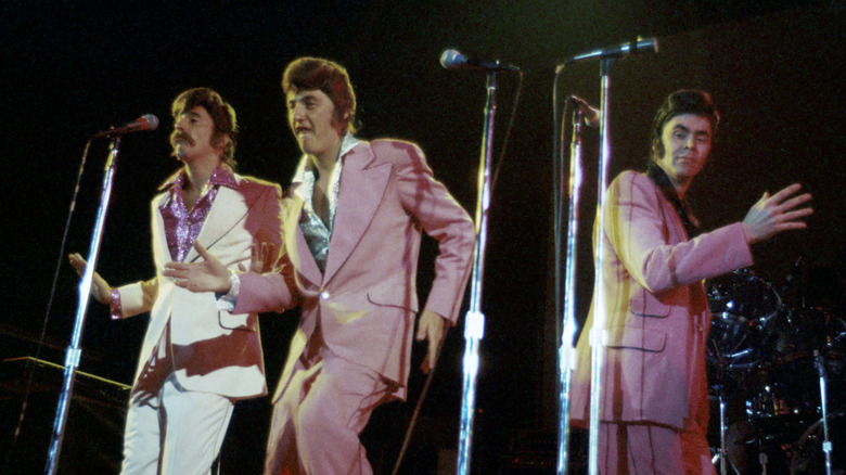 Three Dog Night on stage in lilac suits in the 1970s