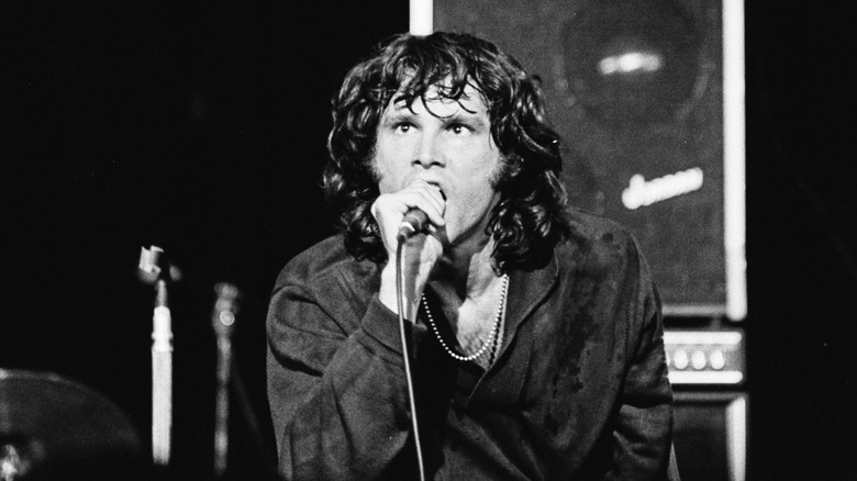 Jim Morrison onstage with microphone