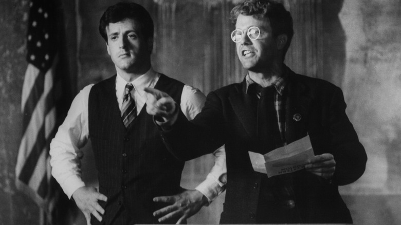 David Huffman and Sylvester Stallone speaking in a film still