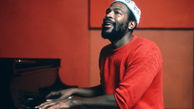 Marvin Gaye playing piano smiling 