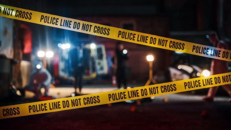 nighttime crime scene with police tape